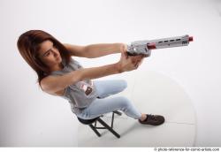 MOLLY SITTING POSE WITH GUN